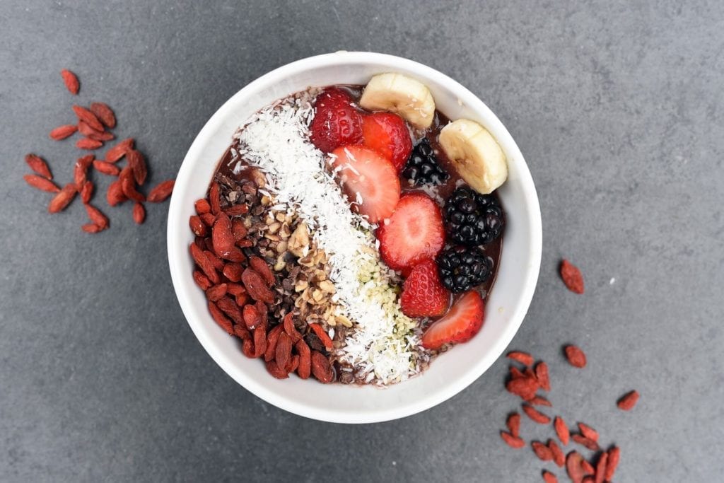 Healthy breakfast bowl with fruit and nuts