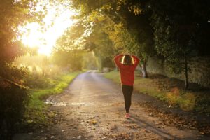 How to Build Better Health and Fitness Habits-lady walking in nature