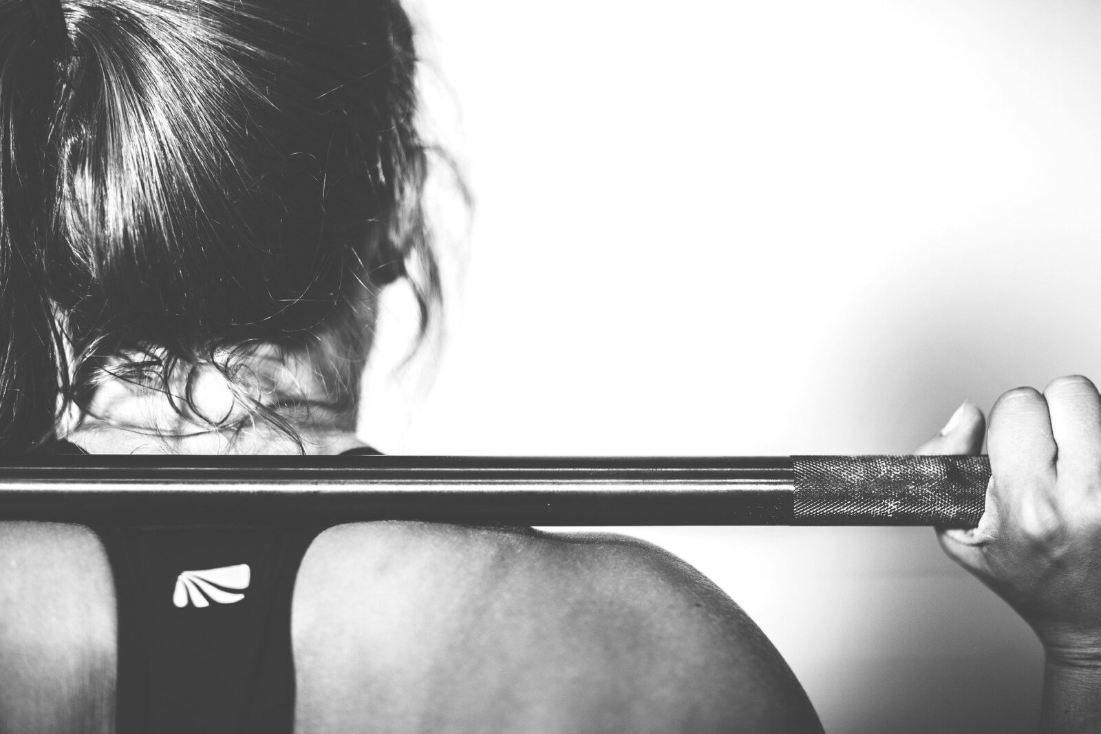 Strength training for runners-barbell back squat-woman-rear view