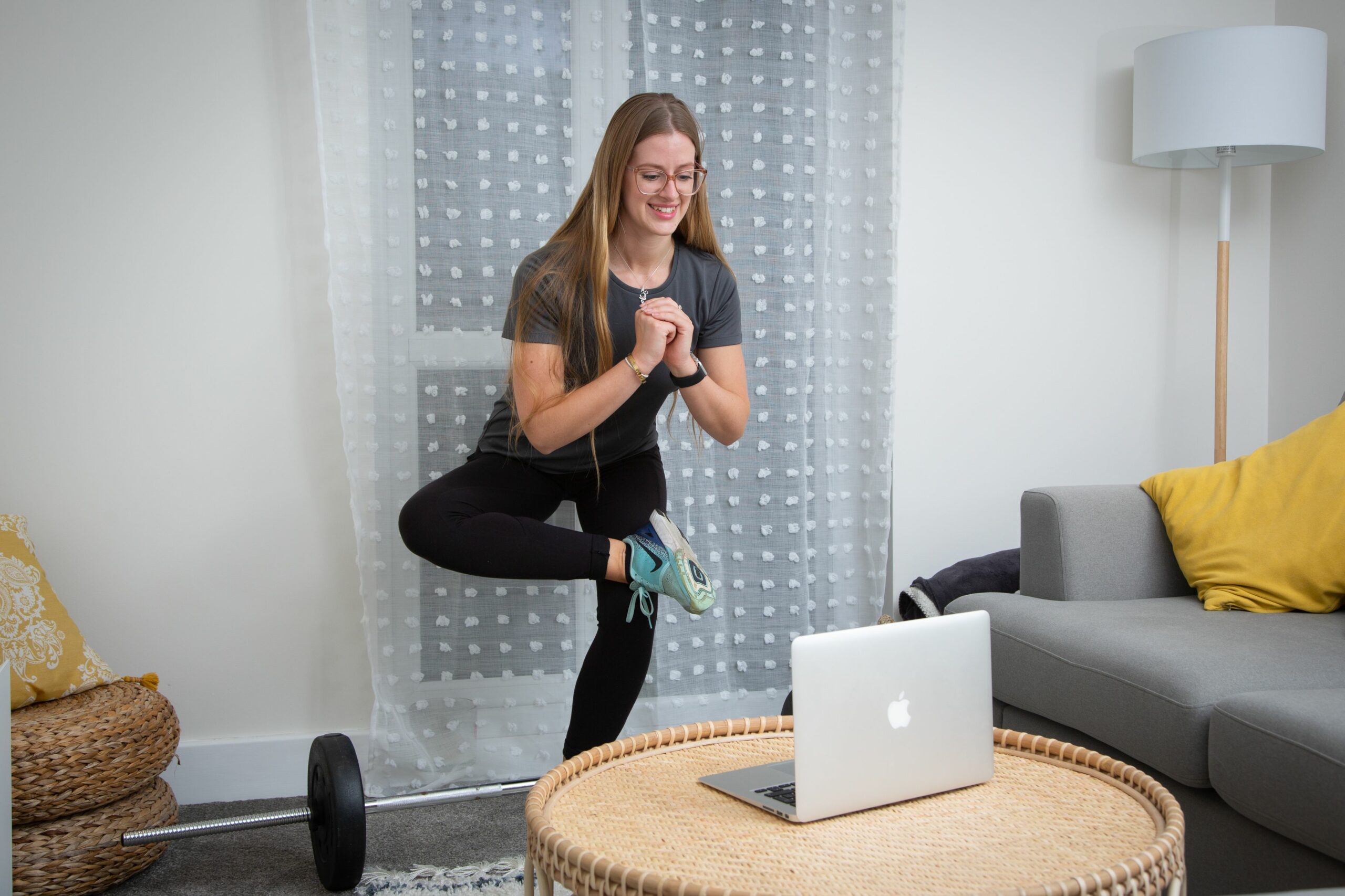 Hannah demonstrates glute stretch in online session